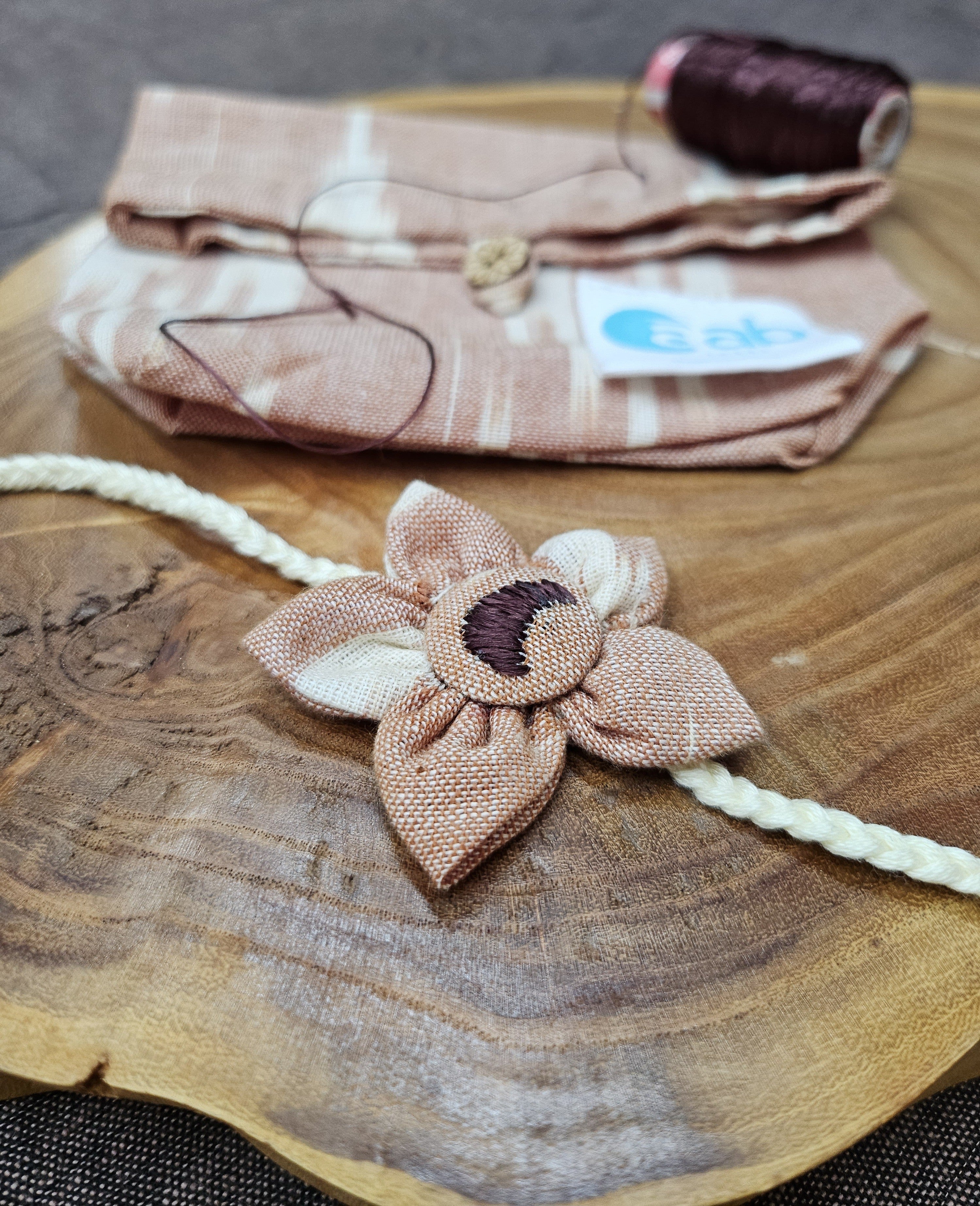 Phulkari Embroidered Flower Rakhi & Upcycled Ikat Pouch (Set of 2)