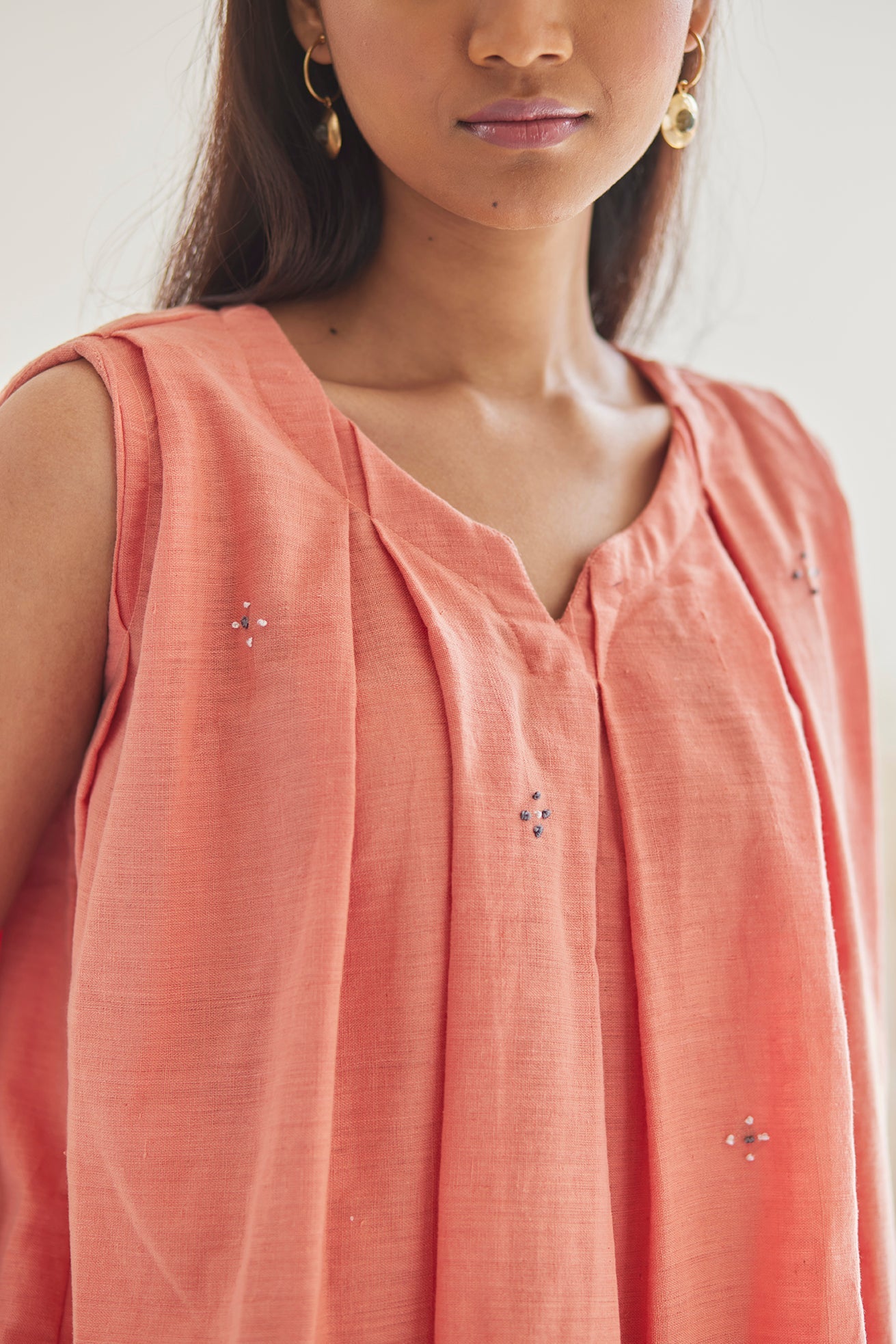 Embroidered Peach Top with White khaddar Pants