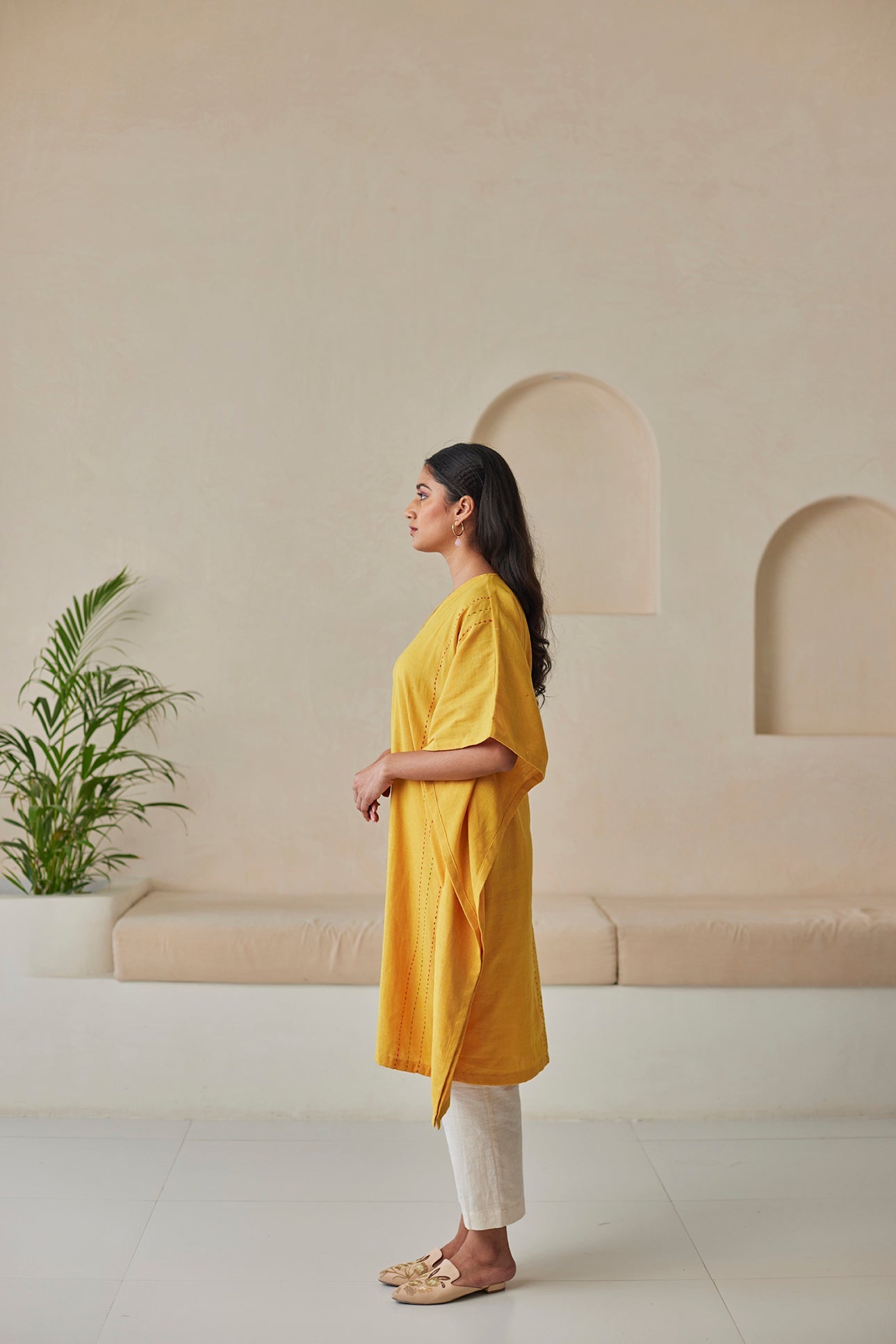 Phulkari hand-embroidered mustard kaftan with white khaddar pants