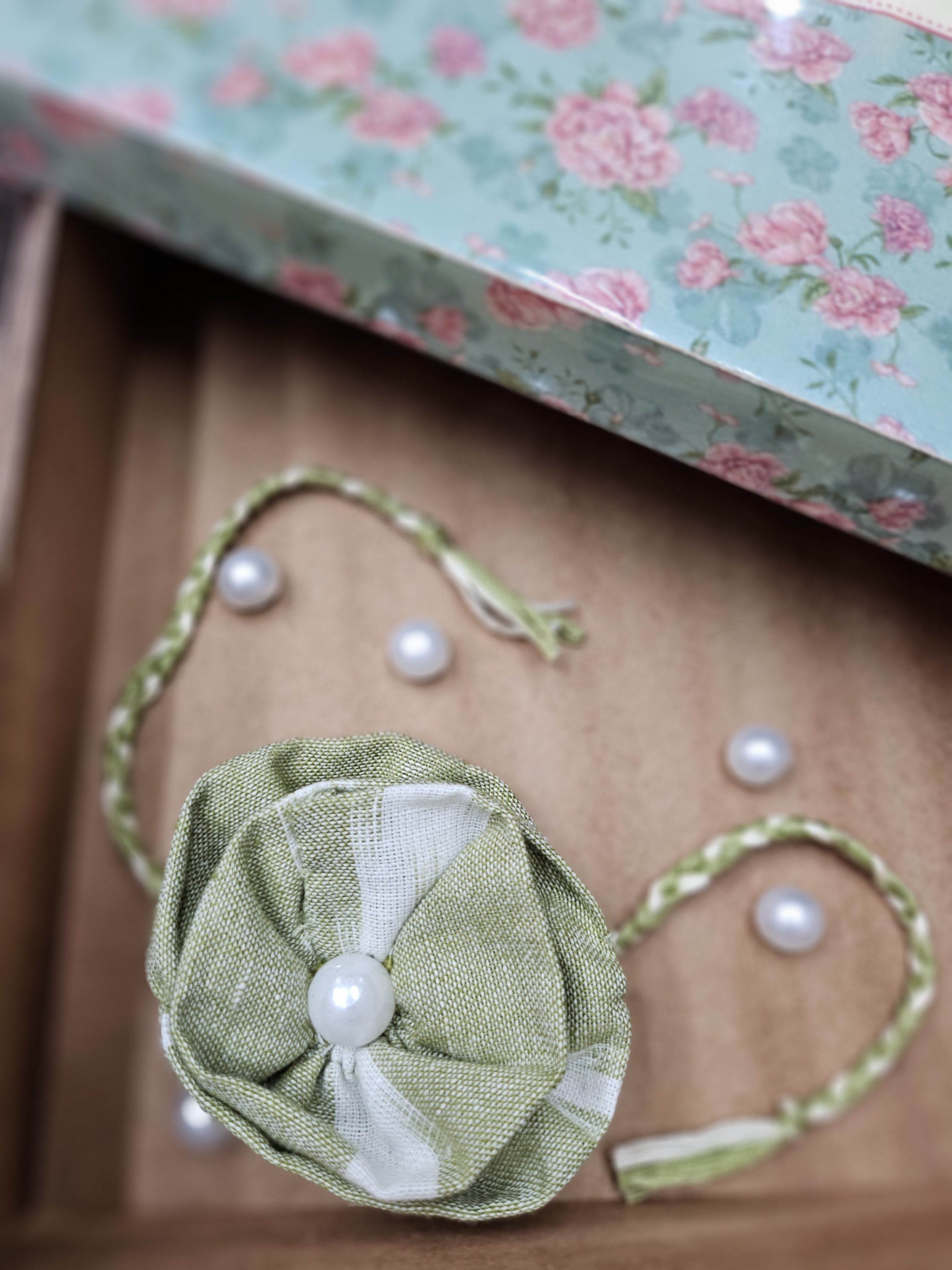 Green Ruffle Flower Rakhi & Upcycled Handwoven Pouch (Set of 2)
